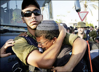 A Soldier Comforts a Settler in Gaza