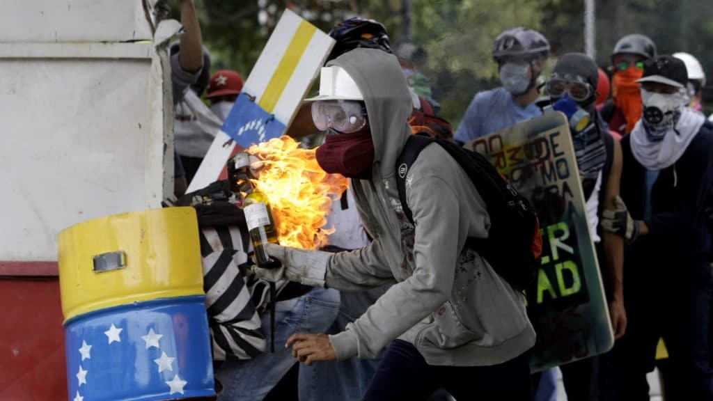 | A demonstrators readies a gasoline bomb as he prepares to throw it at the police during clashes between authorities and anti government demonstrators in Caracas Venezuela Wednesday June 7 2017 The protest movement has claimed more than 60 lives as it enters its third month AP PhotoFernando Llano | MR Online