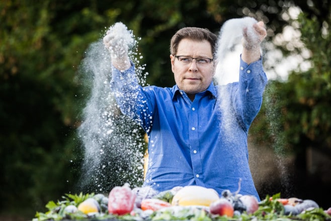 | Mathematician Irakli Loladze tosses sugar over vegetables outside his home in Lincoln Nebraska to illustrate how the sugar content of the plants we eat is increasing as a result of rising carbon dioxide levels Loladze was the first scientist to publish research connecting rising CO2 and changes in plant quality to human nutrition | Geoff Johnson for POLITICO | MR Online