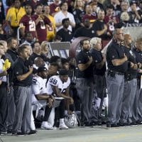 Oakland Raiders teammates kneel during the national anthem, Sep. 24, 2017