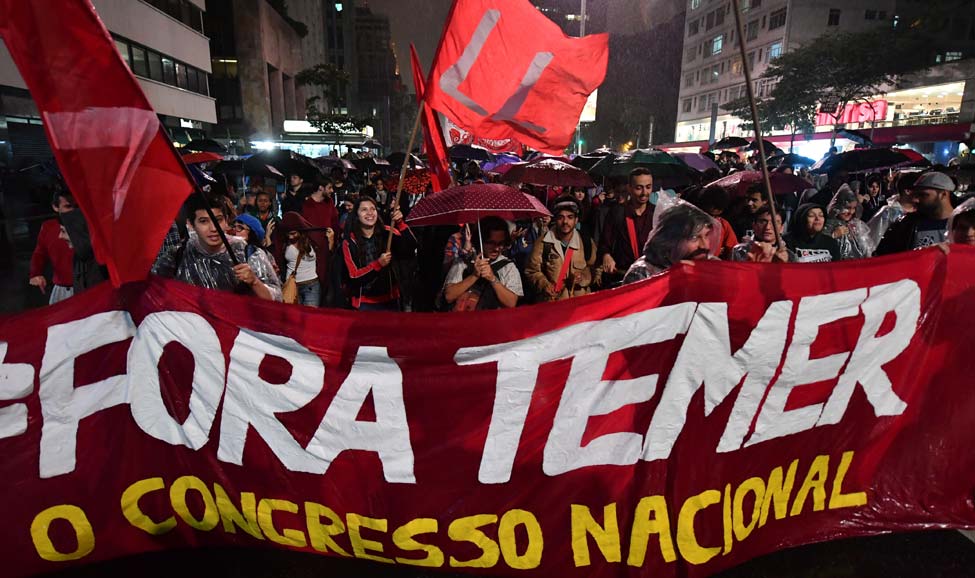 | People protest with the slogan Fora Temer Out with Temer Photo credit The Week | MR Online
