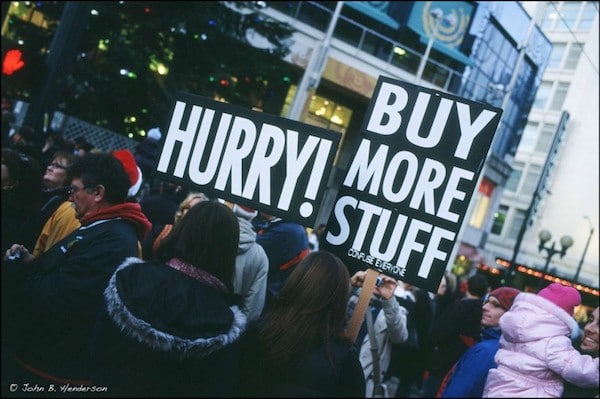 | Hurry Buy More Stuff sign at protest | MR Online