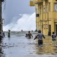 | Habaneros wade through floodwaters near El Malecón after Hurricane Irma YAMIL LAGEAFPGETTY IMAGES | MR Online