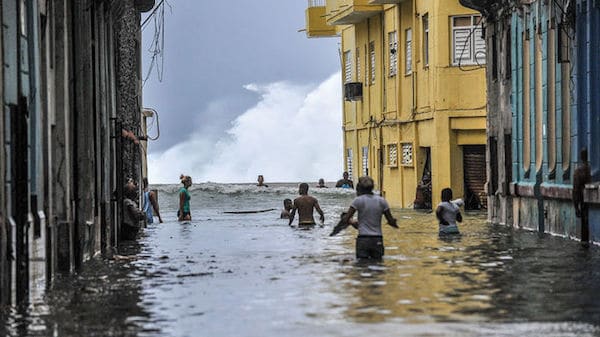 | Habaneros wade through floodwaters near El Malecón after Hurricane Irma YAMIL LAGEAFPGETTY IMAGES | MR Online