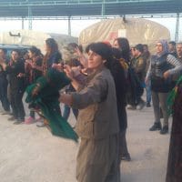 Fighters and women dancing in the street of Afrin