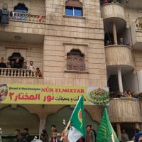 | Refugees watching womens demonstration be from their balconies | MR Online