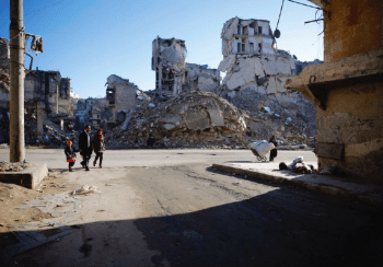 | Family walking by ruins of buildings and homes | MR Online