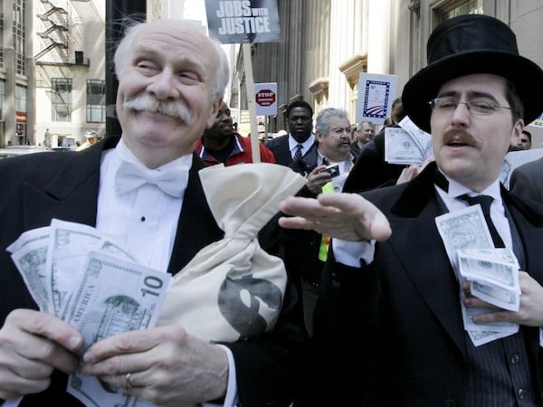| Protesters dressed as wall street bankers march from Goldman Sachs office to a rally in Federal Plaza demanding Wall Street reform Wednesday April 28 2010 in Chicago AP PhotoM Spencer Green | MR Online