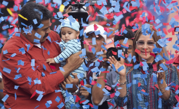 | Venezuelas President Nicolas Maduro holds a baby as first lady Cilia Flores right applauds during a campaign rally in the parish of Catia in Caracas Venezuela last Friday | MR Online