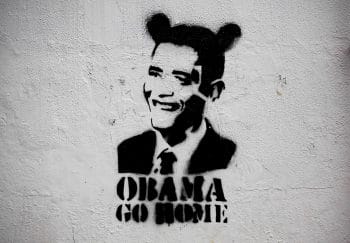 | An image of President Barack Obama wearing fake ears and the slogan Obama go home on a street wall in Caracas Venezuela APAriana Cubillos | MR Online