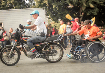 | Man on motorcycle taking a man in wheelchair for a ride PHOTO Rafael Stédile | MR Online