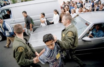 | Los Angeles County Sheriffs deputies hold a young protester | MR Online