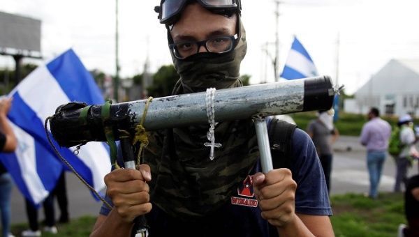 | A demonstrator holds a homemade mortar during a protest against the government of Nicaraguas President Daniel Ortega in Managua Nicaragua June 17 2018 | MR Online