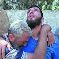 Ezza al-Din Tamimi's father and brother mourning