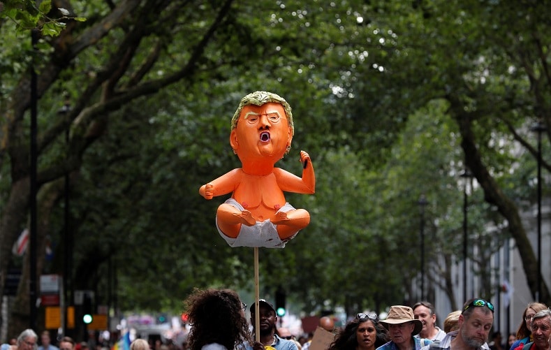 | Demonstrators hold a handmade model depicting a baby Donald Trump as they take part in an anti Trump protest in central London | MR Online