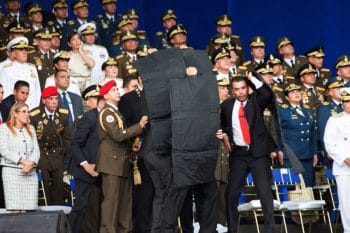 | Bodyguards cover the president as drones carrying explosives are shot down close to his platform | MR Online