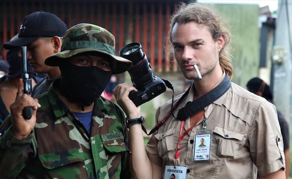 | Carl David Goette Luciak poses with an opposition gunman in the city of Masaya Nicaragua Photo | Edge of Adventure | MR Online