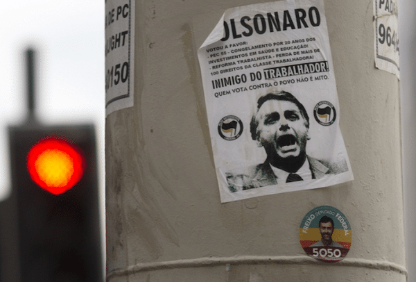 | A sticker calling presidential candidate Jair Bolsonaro as an Enemy of the worker covers a street column in Rio de Janeiro Brazil Photo Credit Morning Star | MR Online