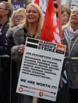 | Women holding Glasgow Womens Strike poster Photo Credit Morning Star Online | MR Online