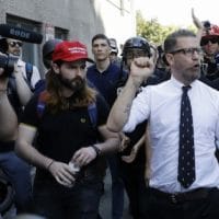Proud Boys co-founder Gavin McInnes is surrounded by supporters at a rally in Berkeley, Calif. (Photo- Marcio Jose Sanchez : AP)