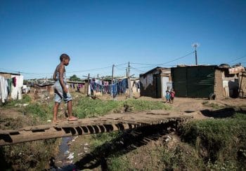 | 29 May 2018 A child walks across an handmade bridge in the Bhambhayi informal settlement in Durban which has been struggling with poor infrastructure and non existent service delivery for years Madelene Cronjé New Frame | MR Online