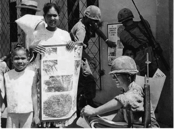 | 1st US PSYWAR Psychological War battalion hands out anti communist posters in Santo Domingo Dominican Republic 1965 | MR Online