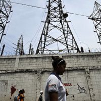 A woman walks in front of electricity pylons in Caracas, Venezuela (File)