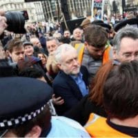 Movement activists, including John Rees, help Jeremy Corbyn back to his car after he spoke at the national demonstration for the NHS on March 6 2017. Photo- Taj Ali