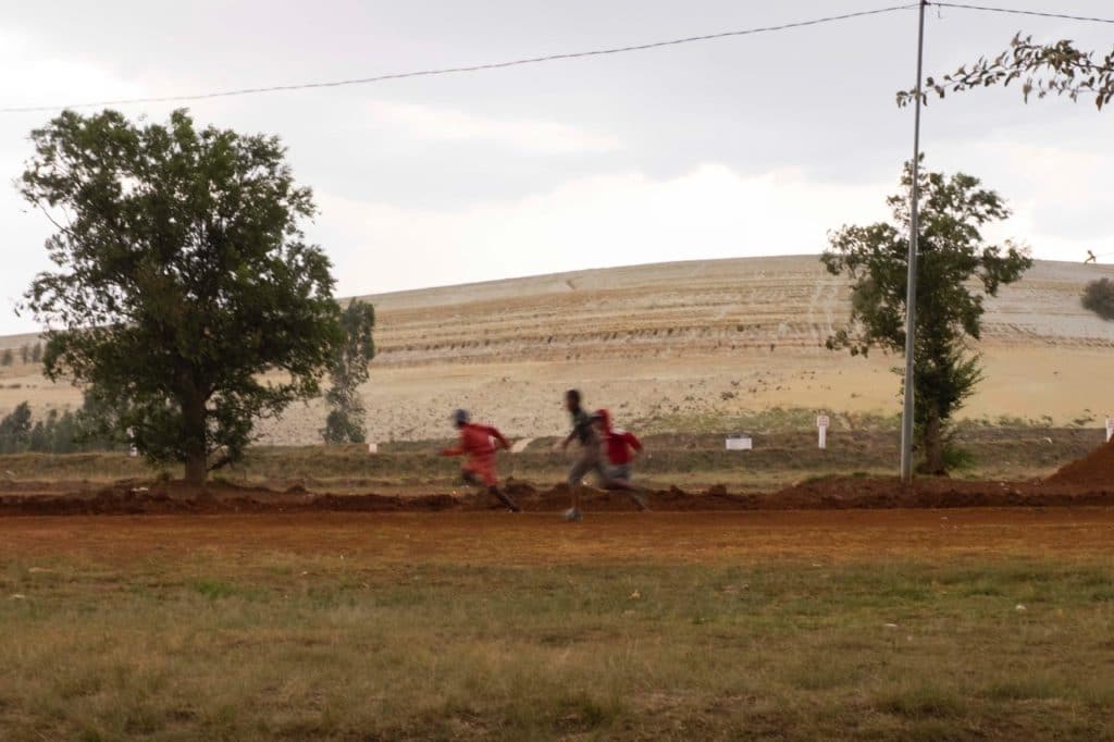 | Children running past a gold mine dump in Slovoville outside of Johannesburg South Africa | MR Online