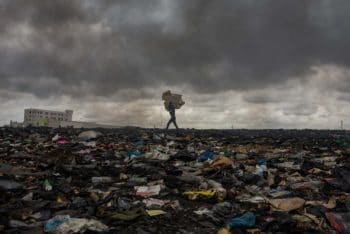 | A worker at Agbogbloshie the worlds largest electronic wastedump in Accra Ghana carries material through what used to be a wetland area | MR Online