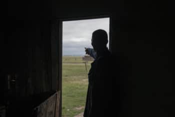 | Makhebengwana Hadebe stands in his kitchen doorway and gestures to where he will be relocated because of Ikwezi Minings Newcastle Project | MR Online