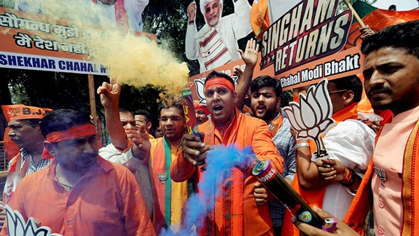 | BJP supporters celebrate landslide victory Photo Reuters | MR Online