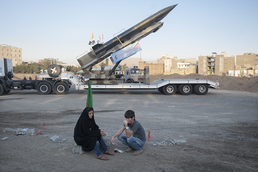 | An Iranian couple rest as they sit in front of the Iranian surface to surface Zelzal missile while visiting an exhibition to mark the anniversary of the Iran Iraq war 1980 88 at a Revolutionary Guard Corps military base in northeastern Tehran September 26 2011 © Morteza Nikoubazl Exhibition to mark the anniversary of the Iran Iraq war 1980 88 | MR Online