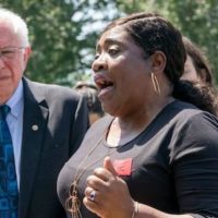 New York Times depiction (7/24/19) of Bernie Sanders at a student debt rally with indebted former student Pamela Hunt. (Photo: J. Scott Applewhite/AP)