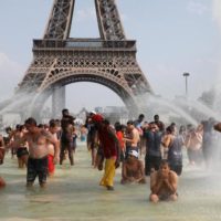 Record-breaking heatwave bakes Europe | Reuters.com Reuters People cool off in the Trocadero fountains across from the Eiffel Tower in Paris as a