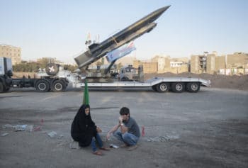 | An Iranian couple rest as they sit in front of the Iranian surface to surface Zelzal missile while visiting of a war exhibition to mark Iran Iraq war 1980 88 anniversary at a Revolutionary Guard Corps military base in northeastern Tehran September 26 2011 | MR Online