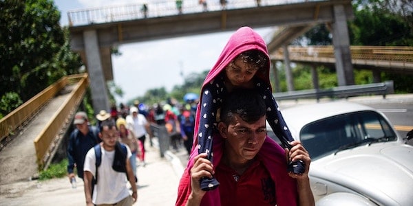 | Central American migrants part of a caravan to the US walk beside the road between Metapa and Tapachula in Mexico on April 12 2019 Photo Pep CompanysAFPGetty Images | MR Online