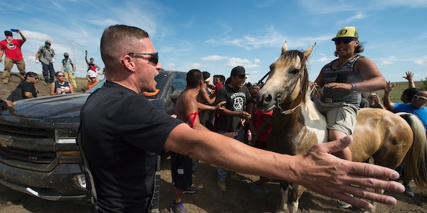| Native American protesters and their supporters are confronted by private security guards at a work site for the Dakota Access pipeline near Cannon Ball ND on Sept 3 2016 Photo Robyn BeckAFPGetty Images | MR Online