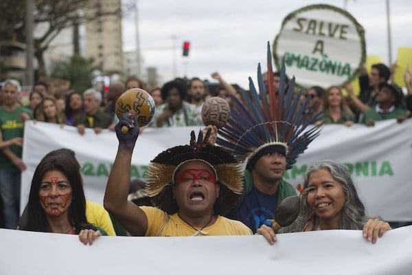 | Indigenous people protest in defense of the Amazon while wildfires burn in that region in Rio de Janeiro Brazil Sunday Aug 25 2019 Experts from the countrys satellite monitoring agency say most of the fires are set by farmers or ranchers clearing existing farmland but the same monitoring agency has reported a sharp increase in deforestation this year as well AP PhotoBruna Prado | MR Online