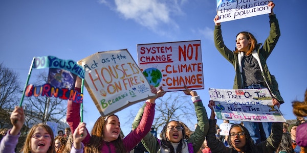 | School children hold placards and shout slogans as they participate in the Strike for Climate Change protest | MR Online