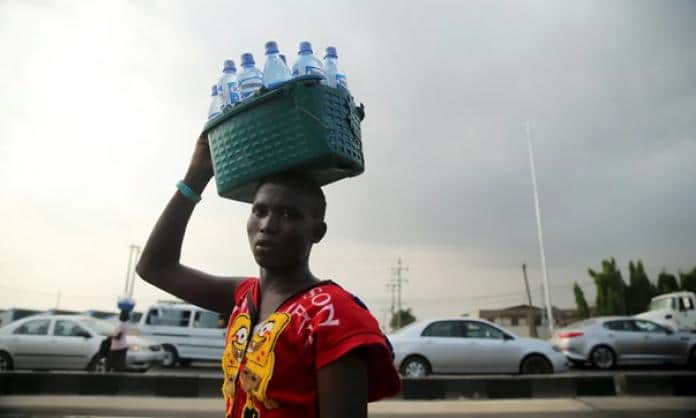 | A man sells bottled water in Lagos Nigeria PHOTO ReutersAkintunde Akinleye | MR Online
