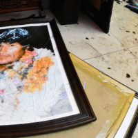 A broken portrait of former Bolivia’s President Evo Morales is on the floor of his private home in Cochabamba, Bolivia, after hooded opponents broke into the residence on, Nov. 10, 2019. Photo | AP