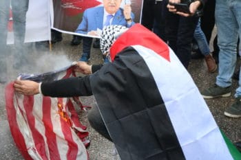 | A Palestinian demonstrator burns the American flag in Bethlehem in protest of US President Donald Trumps peace plan Photo Yumna Patel | MR Online