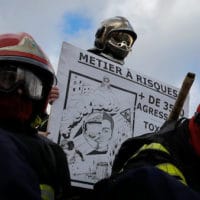 Firefighters gather during a demonstration Tuesday, Jan. 28, 2020 in Paris. Participants want a raise in risk pay from 19% to 25% to fulfil their missions which they say reductions in personnel have made increasingly difficult. They say attacks against them are also on the rise.(AP Photo/Christophe Ena)