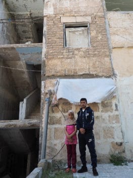 | Mohamed and his sister Asma outside their Aleppo apartment block | MR Online