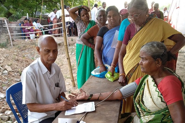 | A volunteer taking a blood pressure test before a doctors consultation at a CPIM run camp in Wyra Khammam District Telangana Tricontinental Institute for Social Research | MR Online