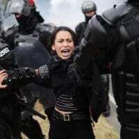 Police detain a protester in Bogota, Colombia, Tuesday, Jan. 21, 2020. Student and labor groups called for new protests as they hope to reignite demonstrations against President Ivan Duque that brought thousands to the streets late last year with a wide range of grievances with his conservative government. (AP Photo/Ivan Valencia)