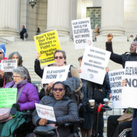 Members of People’s MTA; Rise and Resist’s Elevator Action Group, Disabled In Action; and the People’s Power Assemblies NYC protest at the base of the New York State Supreme Court Building