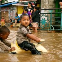 Children playing in flood water