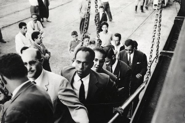 | Frantz Fanon walking up a ship gangway To Fanons right is Rheda Malek a journalist from the Algerian National Liberation Front newspaper El Moudjahid Frantz Fanon Archives IMEC | MR Online